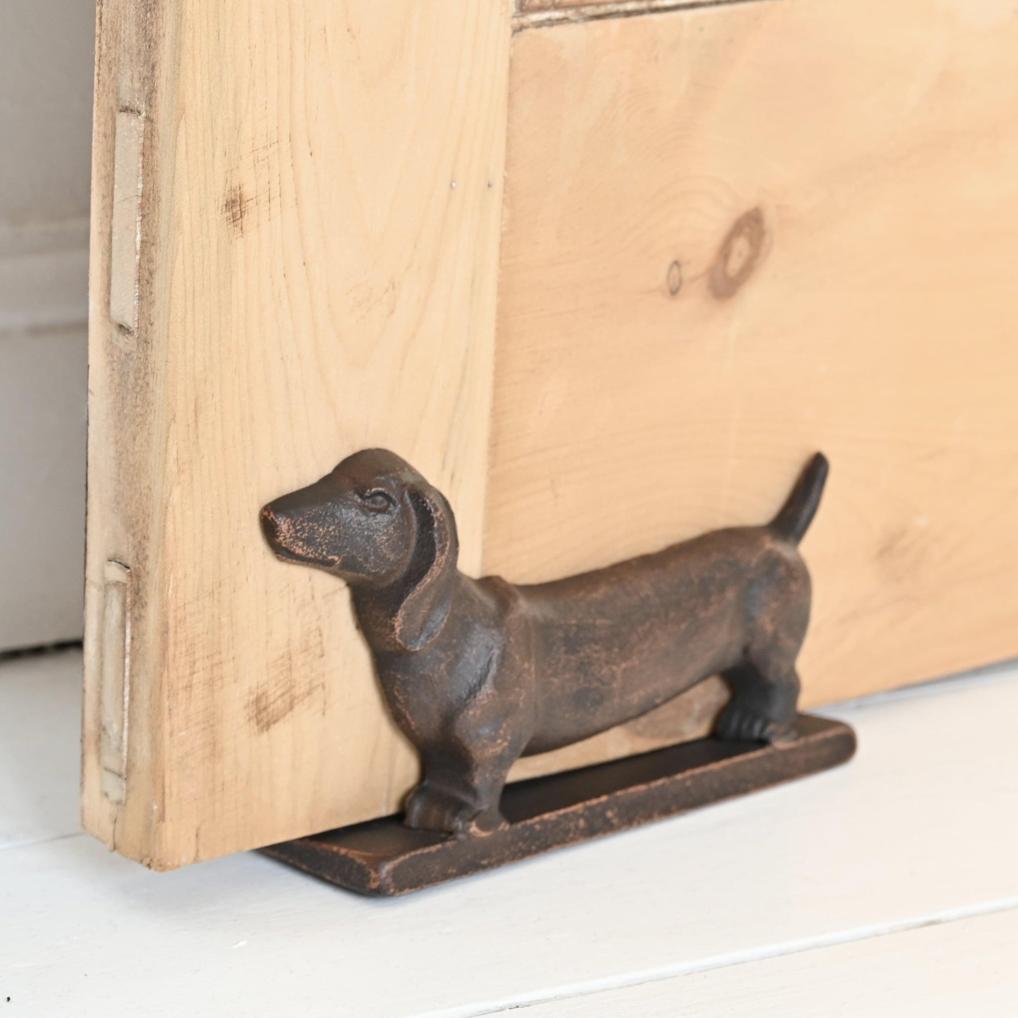 Sausage dog door stop top